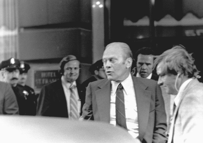 President Gerald Ford winces at the sound of a gunshot fired by Sara Jane Moore