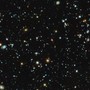 An image of galaxies and star clusters in space