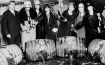 Temperance women breaking barrels of seized liquor during Prohibition.
