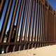 A child looks through the bars of a wall from the side of Ciudad Juarez, Mexico, in this picture taken from the side of El Paso, Texas.
