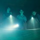 A still from Ghostbusters showing four kids holding flashlights in a blue fog