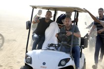 Picture of Palestinians transporting a captured Israeli civilian from Kibbutz Kfar Azza, near the Gaza border, into the Gaza Strip on Saturday, Oct. 7, 2023.