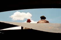 Father and son looking at clouds on a sunny day