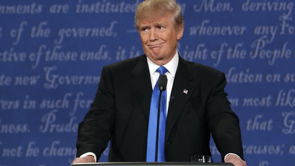 Republican U.S. presidential nominee Donald Trump reacts during the first debate with Democratic U.S. presidential nominee Hillary Clinton at Hofstra University in Hempstead, New York, U.S., September 26, 2016. 