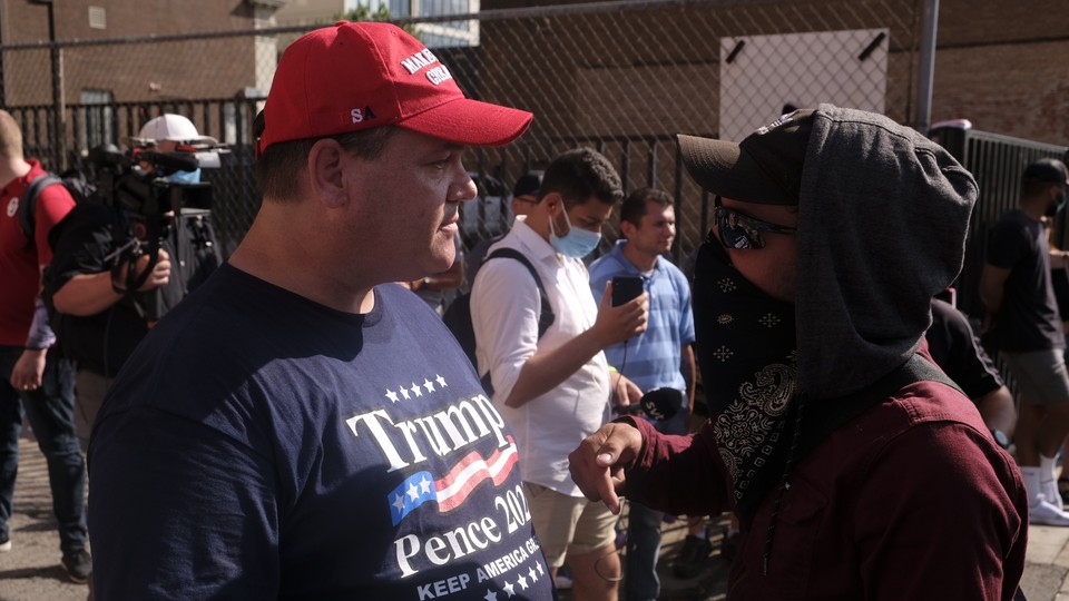 Trump supporters and protestors at a rally in Tulsa