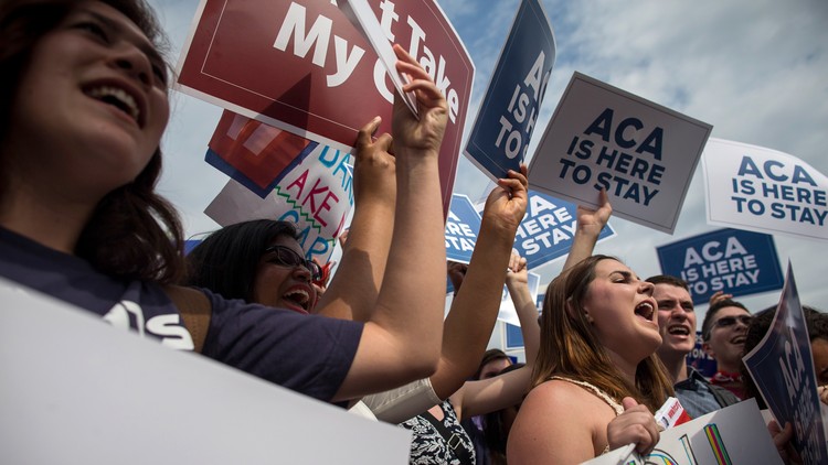 People protesting for the ACA