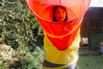 A girl plays outside in her backyard during coronavirus confinement.