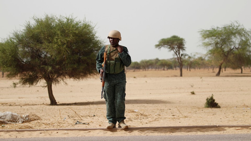 A Nigerian soldier stands guard following attacks by Boko Haram in June 2016. 