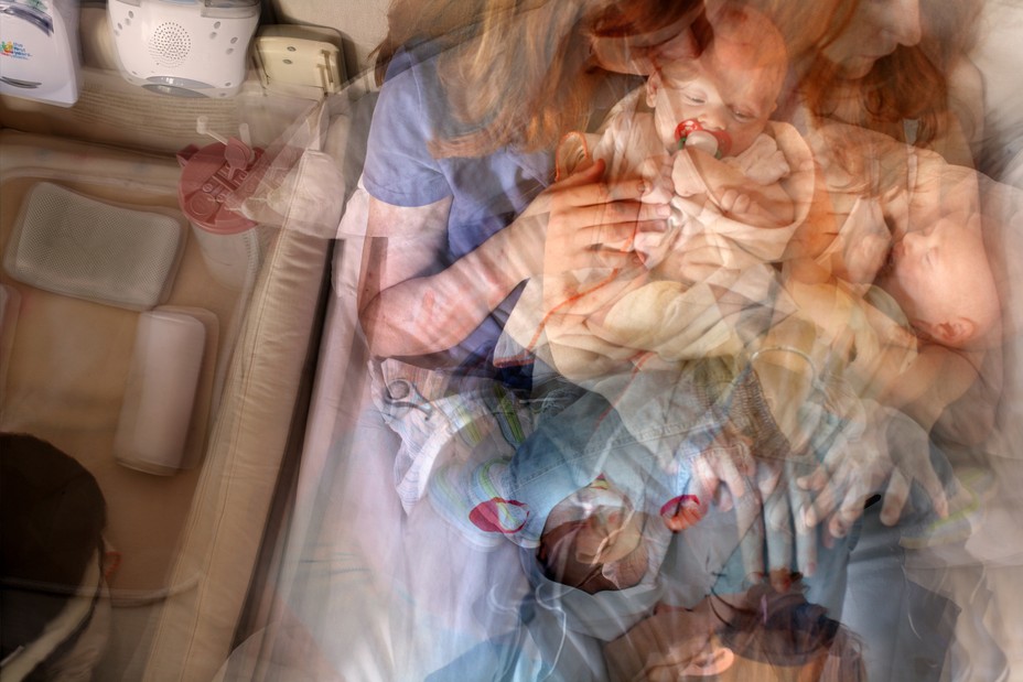 Photo illustration: from overhead, layered photographs of mother holding baby in bed