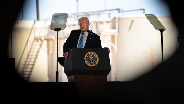 Donald Trump speaking in front of an oil rig
