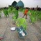 A field of empty chairs with a discarded campaign poster