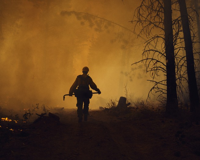 A smoke jumper seen in a fire