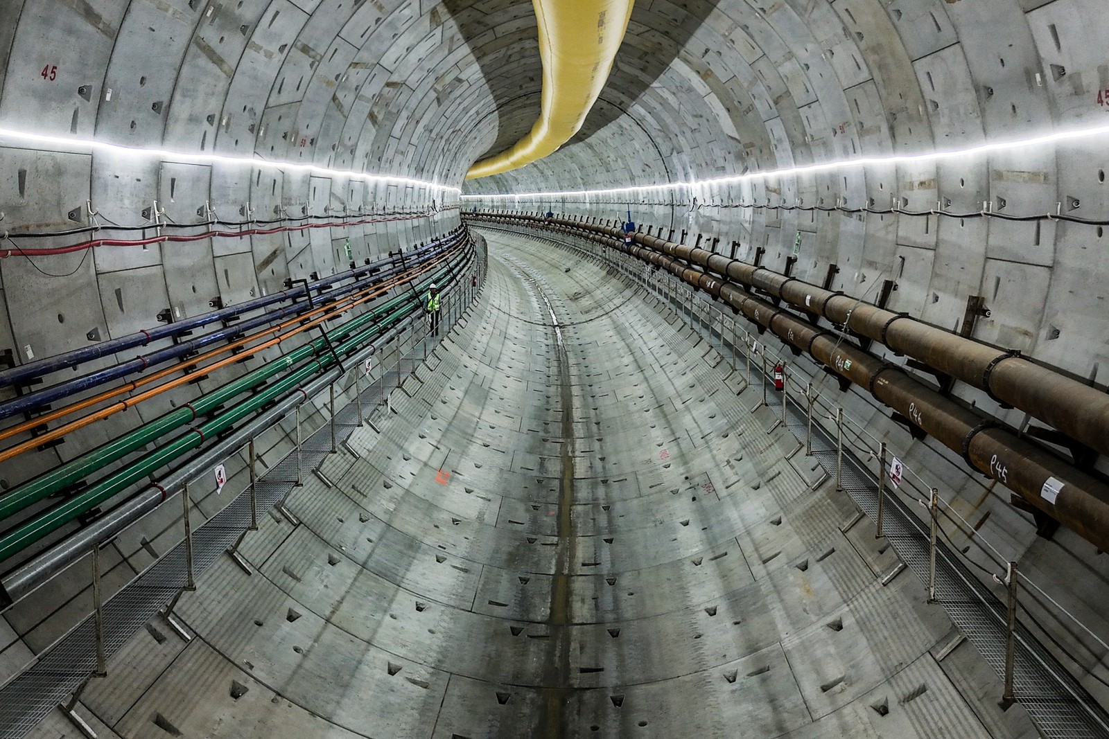 A view down a long and large curving tunnel
