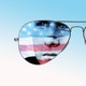 Photo illustration of stills from the movie "Top Gun" set inside a pair of aviator sunglasses.