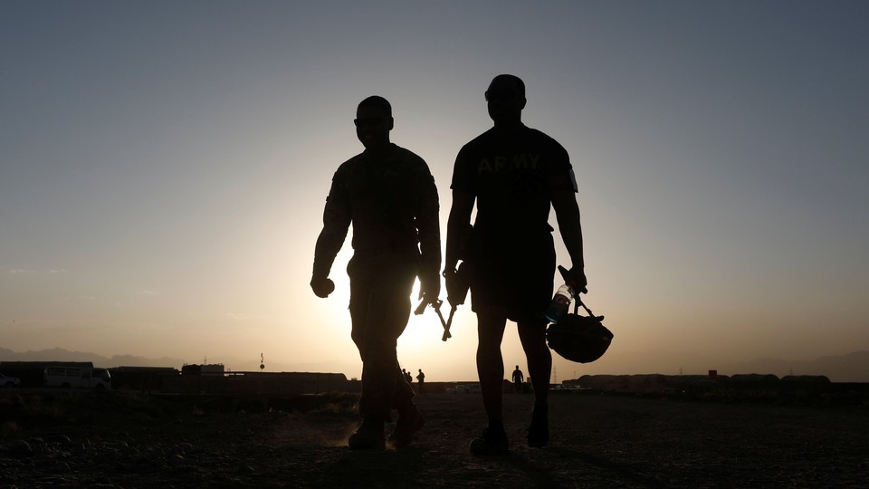U.S. troops walk at their base in Logar province, Afghanistan, on August 4, 2018.