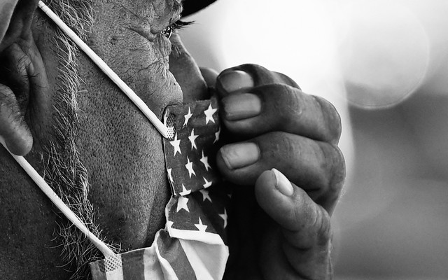 Man wearing an American flag facemask