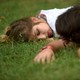 A couple sleeping in the grass