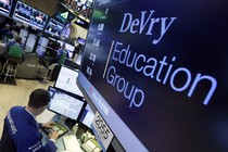 A screen showing the words DeVry Education Group at the New York stock exchange.