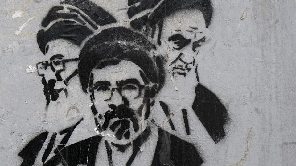 Stencil images of Ayatollah Khomeini the founder of Islamic Republic (R) seen next to Ayatollah Khamenei (L) and his son Mojtaba Khamenei (M) his successor as new supreme leader appear on a wall in Tajrish Square on March 28, 2026 in Tehran, Iran.
