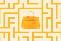 A yellow Hermès Birkin bag inside a yellow maze pattern