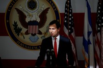 Jared Kushner stands at a podium