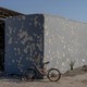 A photo of an abandoned bike in front of a shelter near the Nahal Oz kibbutz in Israel