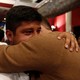 Two men hug and cry after the nation votes "no" on the recent FARC referendum.