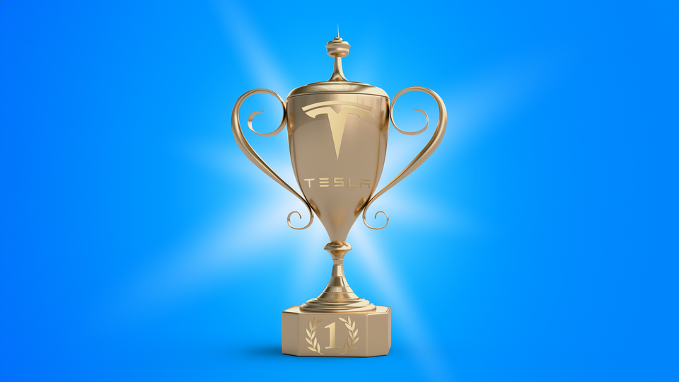 A trophy with Tesla's logo on it