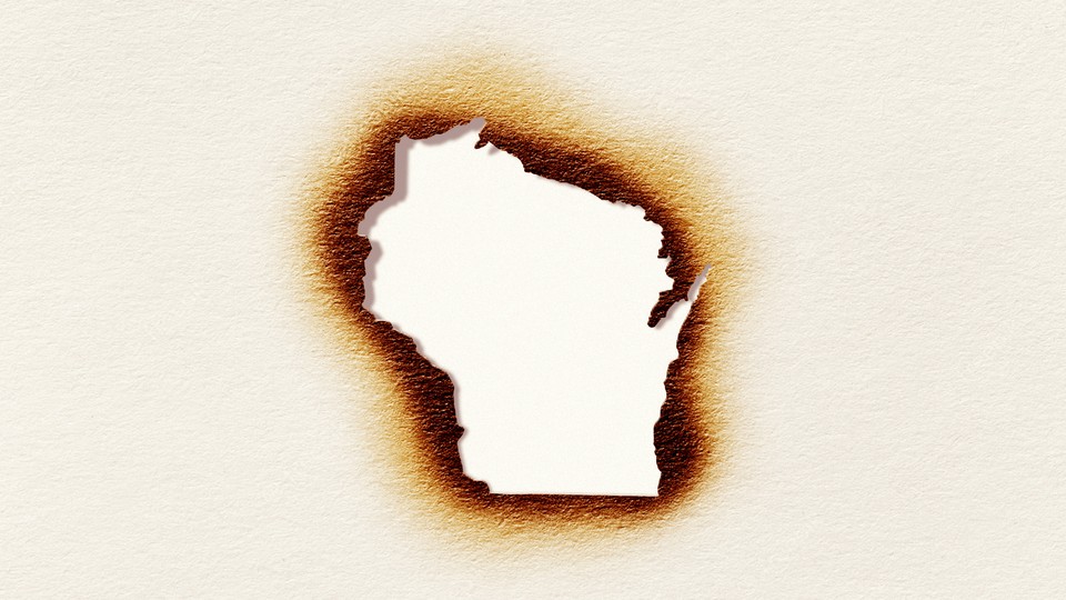 An illustration of a Wisconsin-shaped hole singed in a piece of paper