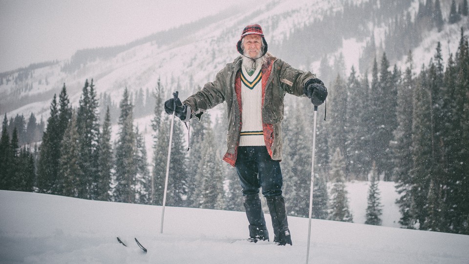 Billy Barr stands in the snow at his home below Gothic Mountain