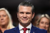 Pete Hegsth smiles during his Senate confirmation hearing