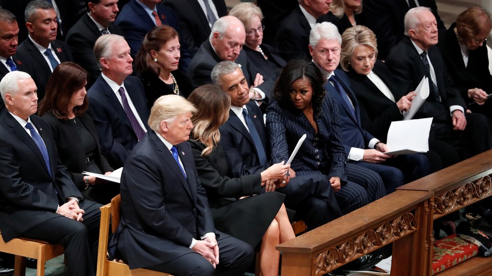 Donald and Melania Trump are seated next to Barack and Michelle Obama at George H. W. Bush's funeral.