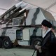 Ayatollah Ali Khamenei is seen near a "3 Khordad" system, which is said to have been used to shoot down a U.S. military drone.