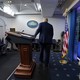 The president leaves the White House briefing room.