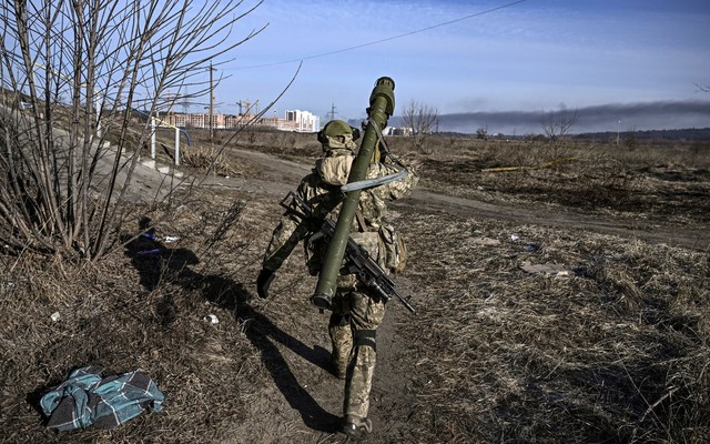 Ukrainian serviceman walking away from the camera