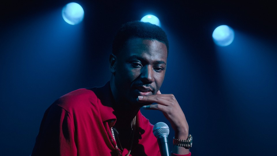 Jerrod Carmichael pausing in reflection during his comedy special "Rothaniel"