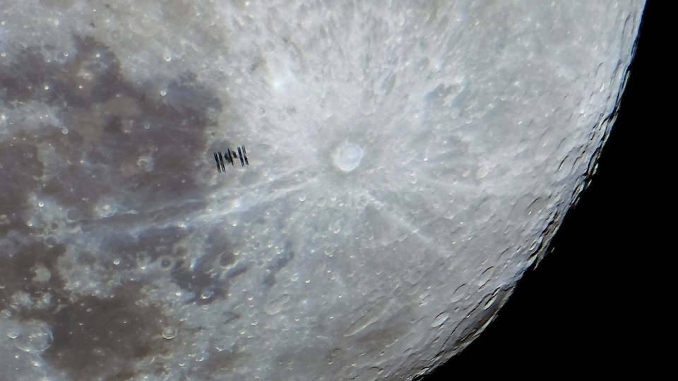 An image of the Moon and the International Space Station