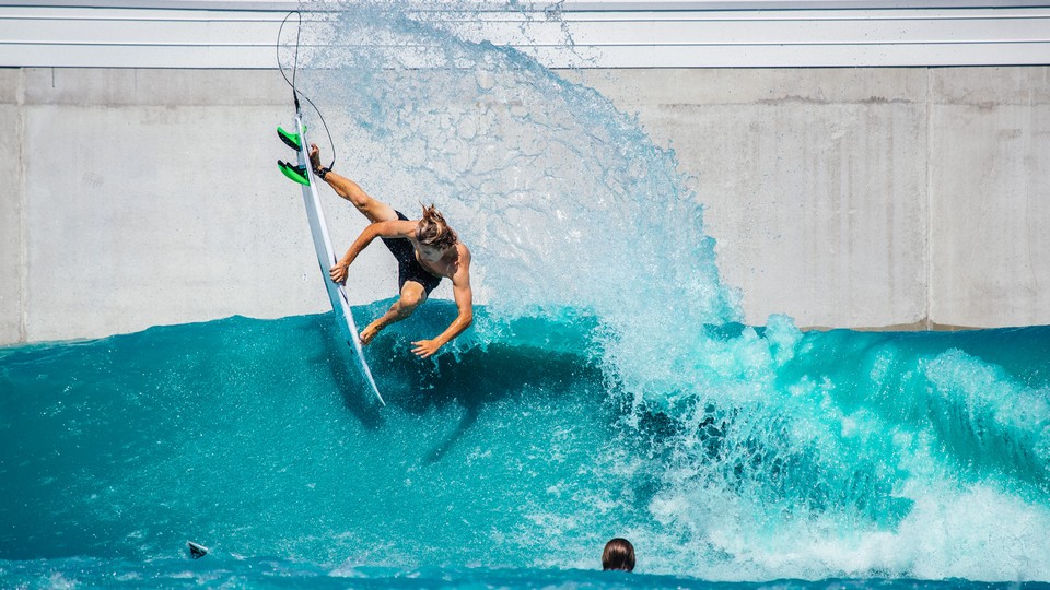 A surfer in a wave pool in Waco, Texas