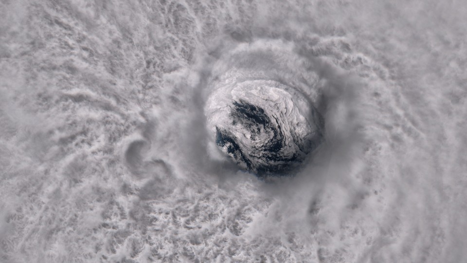 The massive circular eye of Hurricane Jose is seen from space at super high resolution. Convection is visible in the clouds that surround the well-defined eyewall, and the whitecaps of waves can be glimpsed through the center of the eye.