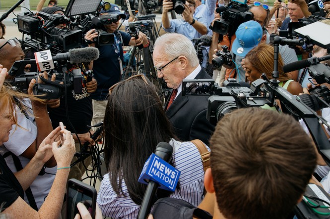 Picture of defense attorney Kevin Reddington leaving Plymouth Superior Court surrounded by media.