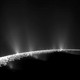 A spacecraft image of the south pole of Enceladus, Saturn's icy moon, spewing water vapor into space through cracks in its frigid surface