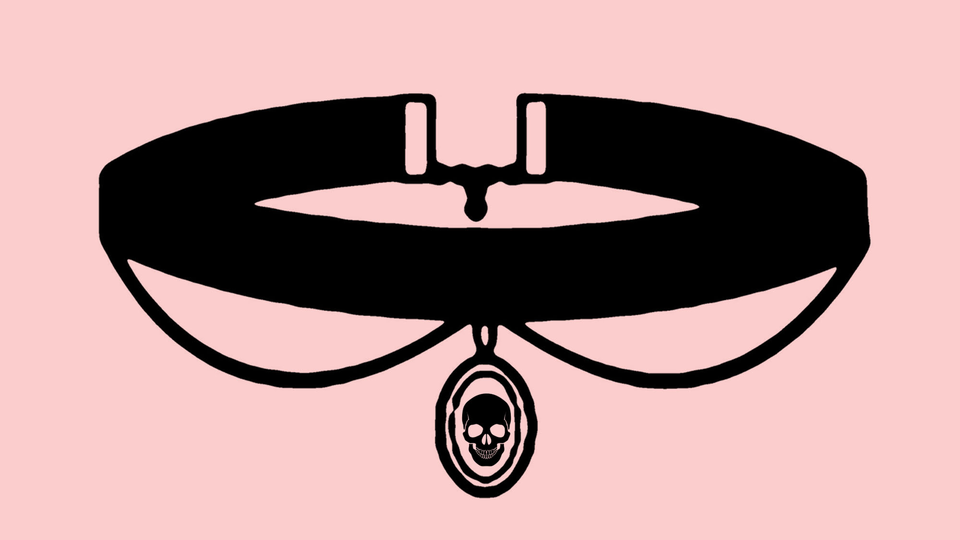 A black choker necklace on a pink background