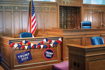 Photo-illustration of wood-paneled court chamber with judge's bench, American flag, and campaign bunting and posters saying "Trump 2024" around the witness stand