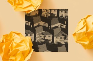 A black-and-white photo showing a handful of densely arranged single-family homes