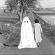 Ghost next to a woman as she walks down a country road
