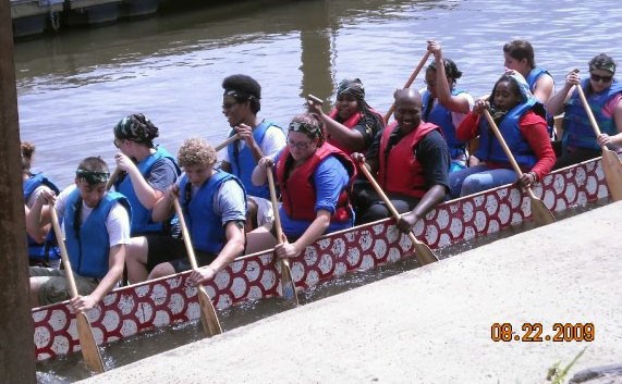Jasmaine and Alex participate in dragon boat training with other RAs.