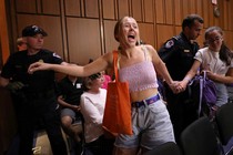 A protester interrupts the Kavanaugh hearings on Friday.