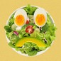 An illustration of a salad in the shape of a frowny face