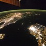 A view of Earth from space with artificial lights at night