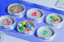 A photo of petri dishes from different animals filled with varying amounts of bacteria